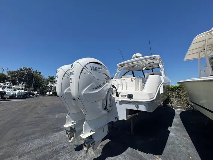  Yacht Photos Pics 2019 Everglades 340 Dual Console boat with twin Yamaha outboard engines, parked outdoors.