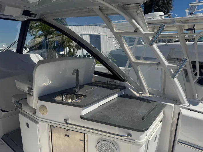  Yacht Photos Pics 2019 Everglades 340 Dual Console boat interior with kitchenette and sink.