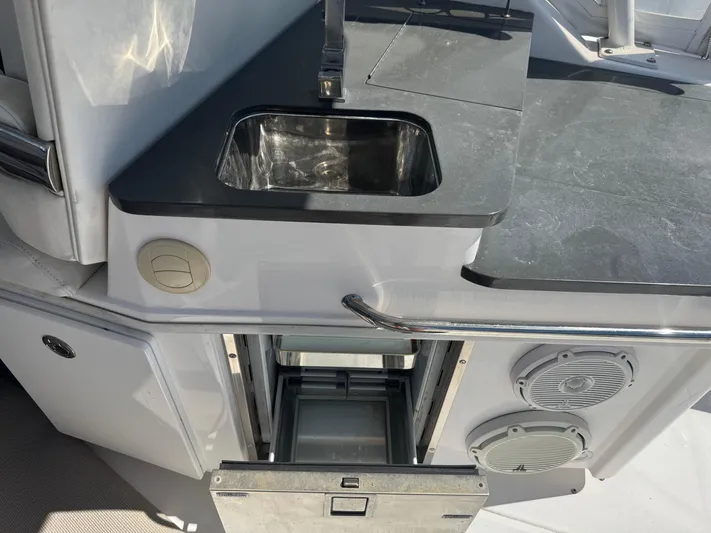  Yacht Photos Pics 2019 Everglades 340 Dual Console boat kitchen with sink and storage.