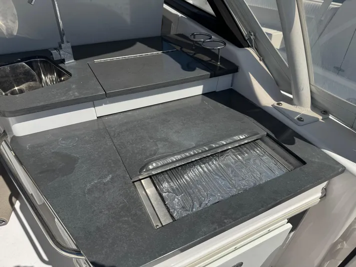  Yacht Photos Pics 2019 Everglades 340 Dual Console boat kitchen area with sink and countertop.