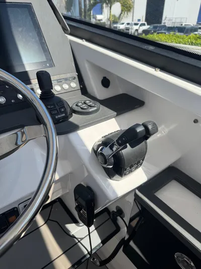  Yacht Photos Pics Control panel of 2019 Everglades 340 Dual Console boat, featuring steering wheel and throttle.