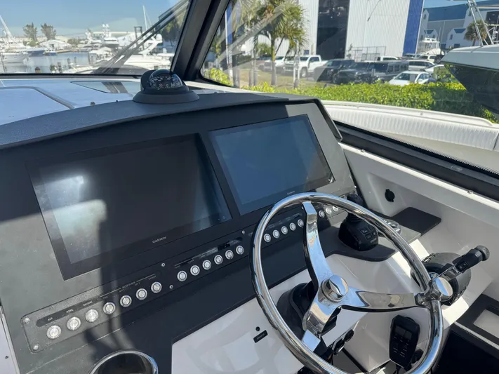  Yacht Photos Pics Cockpit view of 2019 Everglades 340 Dual Console boat with modern navigation screens.