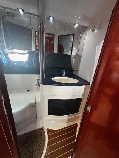 Yacht Photos Pics 1997 Fairline Phantom 37 yacht bathroom with modern fixtures and wooden accents.