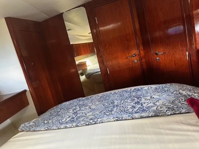  Yacht Photos Pics Luxurious cabin interior of 1997 Fairline Phantom 37 yacht with wooden finishes.