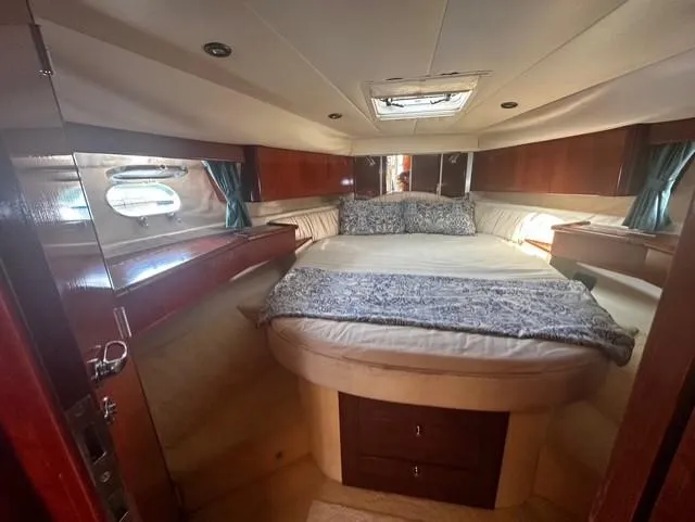  Yacht Photos Pics Luxurious cabin interior of 1997 Fairline Phantom 37 yacht with cozy bed.