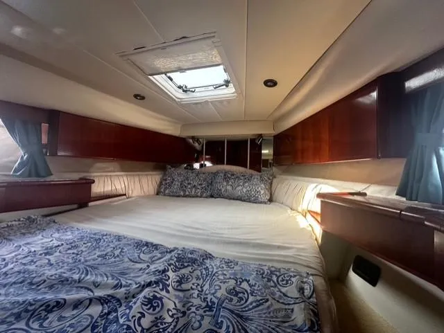  Yacht Photos Pics Luxurious cabin interior of 1997 Fairline Phantom 37 yacht with elegant bedding.