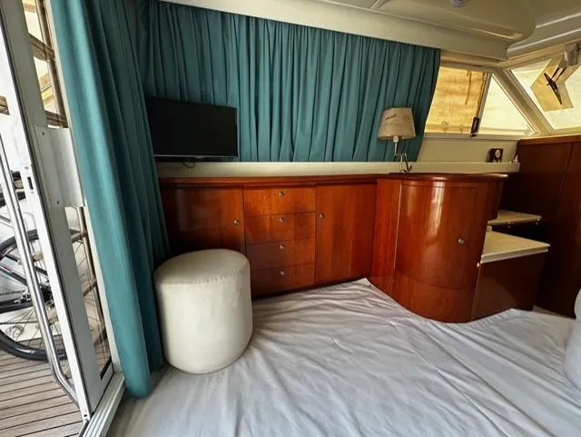  Yacht Photos Pics Interior of 1997 Fairline Phantom 37 yacht with wooden cabinetry and modern decor.