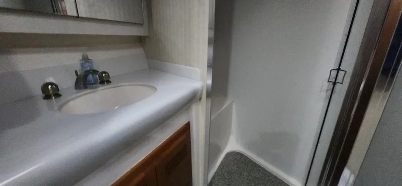 Laura K Yacht Photos Pics 2004 Cabo 48 Convertible yacht bathroom with sink and shower.