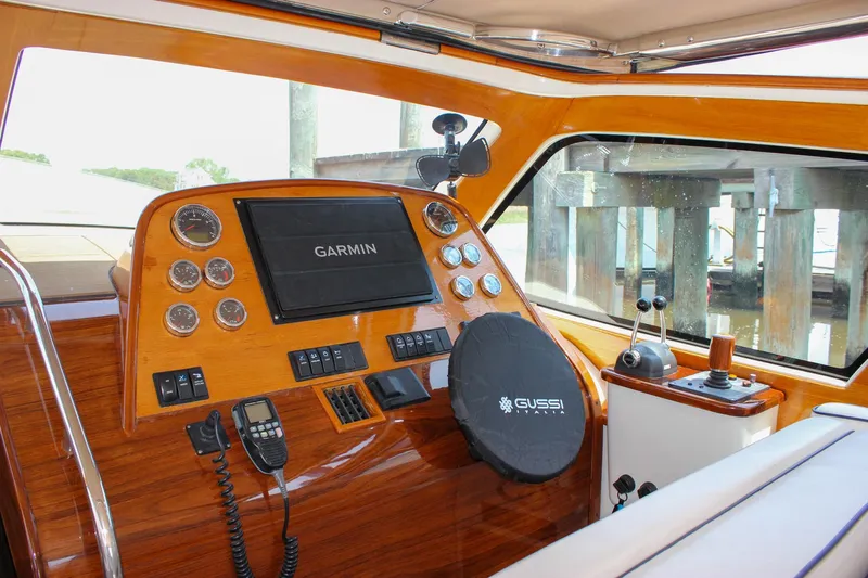 Sunny Daze Yacht Photos Pics 2008 Hinckley Talaria 38R Convertible dashboard with Garmin navigation and Gussi Italia steering wheel.
