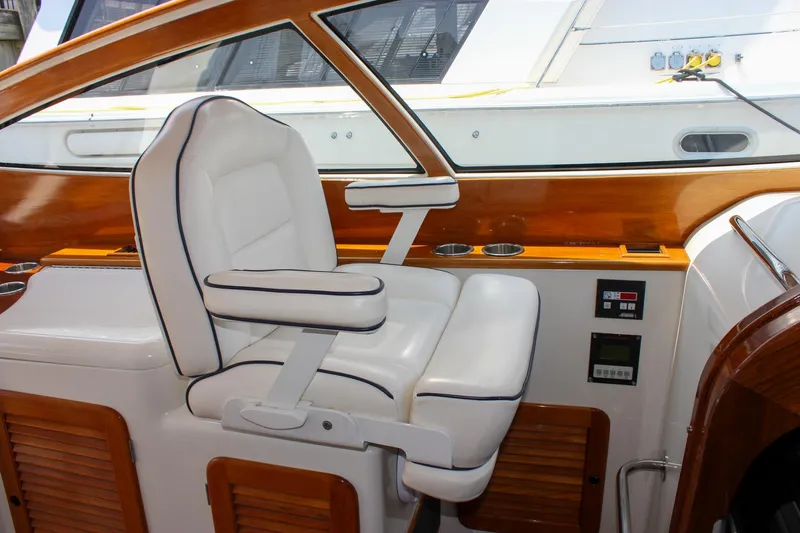 Sunny Daze Yacht Photos Pics Luxurious white captain's chair on 2008 Hinckley Talaria 38R Convertible yacht.