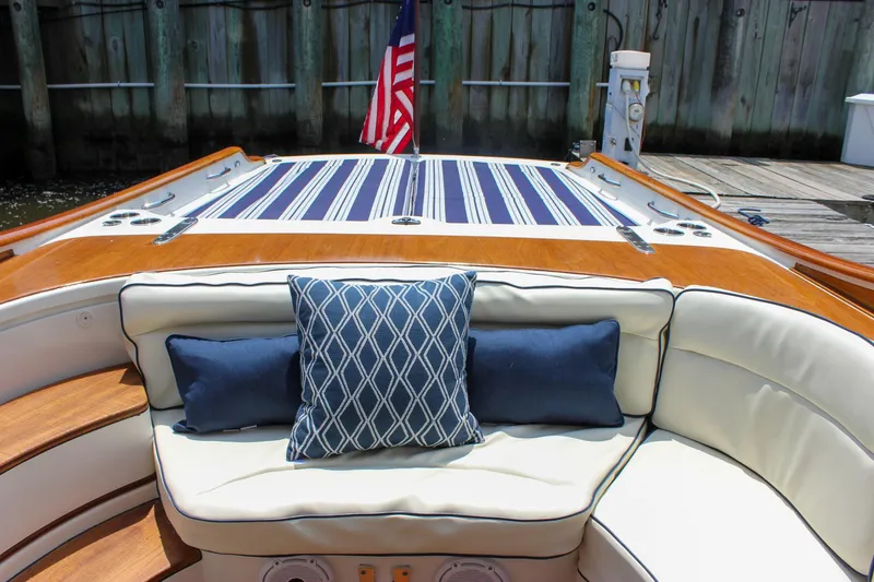 Sunny Daze Yacht Photos Pics Luxury seating on 2008 Hinckley Talaria 38R Convertible yacht with striped cushions and American flag.