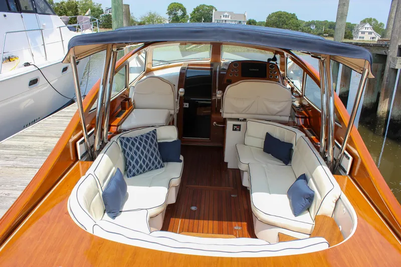 Sunny Daze Yacht Photos Pics 2008 Hinckley Talaria 38R Convertible yacht with elegant seating and wooden deck.