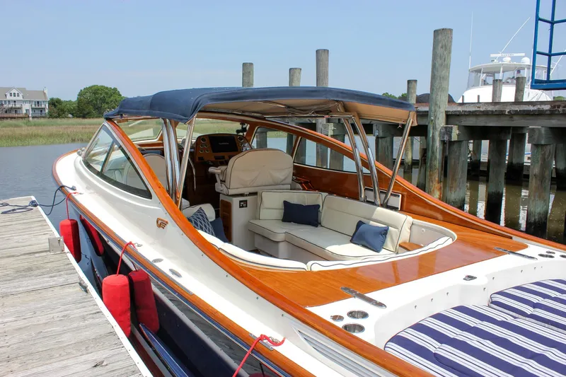 Sunny Daze Yacht Photos Pics 2008 Hinckley Talaria 38R Convertible yacht docked, featuring elegant seating and polished wood finish.