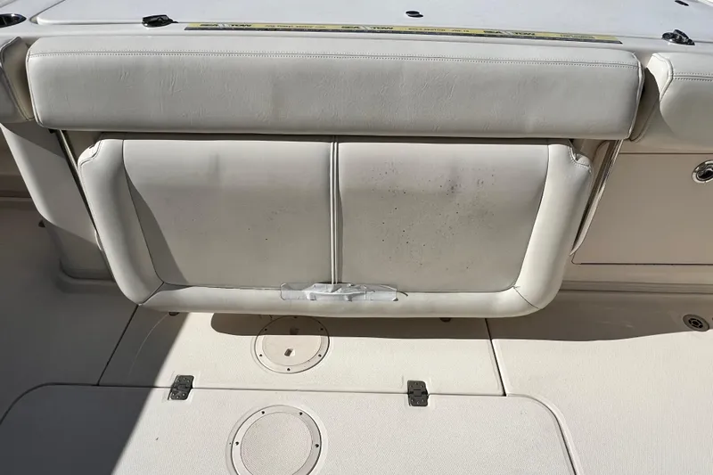 Reel E Blessed Yacht Photos Pics 2017 Grady-White Express 330 boat seat with storage compartment, white upholstery.