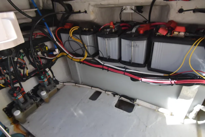 Reel E Blessed Yacht Photos Pics Electrical system of a 2017 Grady-White Express 330 boat, featuring batteries and wiring.