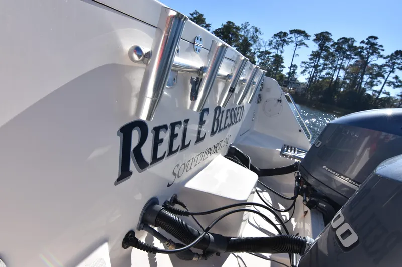 Reel E Blessed Yacht Photos Pics 2017 Grady-White Express 330 boat with "Reel Blessed" name, docked near trees.