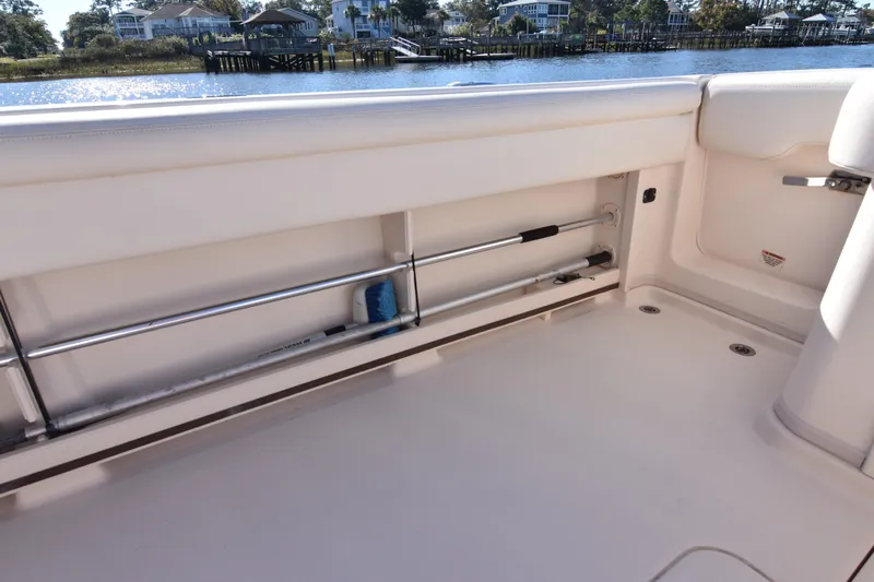 Reel E Blessed Yacht Photos Pics 2017 Grady-White Express 330 boat interior with rod storage, near waterfront homes.