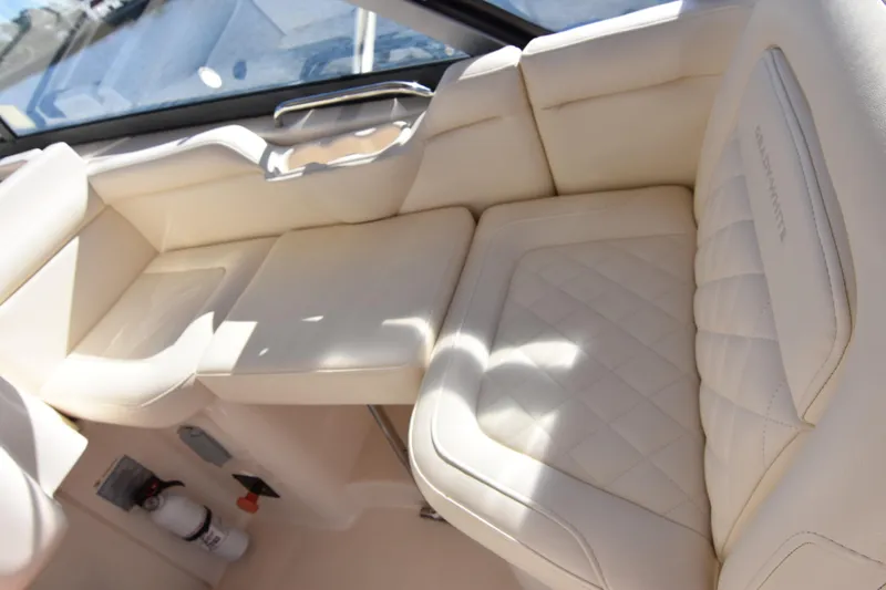 Reel E Blessed Yacht Photos Pics Luxurious seating on 2017 Grady-White Express 330 boat, featuring cream upholstery and diamond stitching.