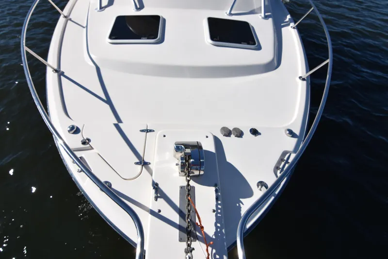 Reel E Blessed Yacht Photos Pics 2017 Grady-White Express 330 boat deck with anchor, on calm water.