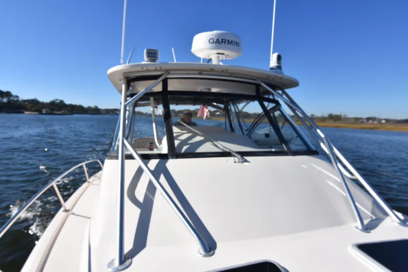 Reel E Blessed Yacht Photos Pics 2017 Grady-White Express 330 boat cruising on a sunny day with Garmin equipment.
