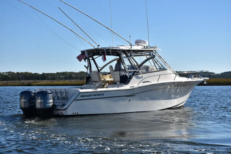 Reel E Blessed Yacht Photos Pics 2017 Grady-White Express 330 boat on water with fishing rods and twin Yamaha engines.