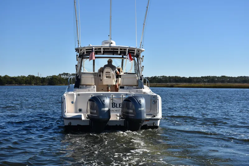 Reel E Blessed Yacht Photos Pics 2017 Grady-White Express 330 boat cruising on a calm lake.