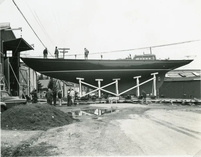 Windigo Yacht Photos Pics 1956 Hinckley S & S Yawl sailboat on supports, surrounded by workers in a shipyard.