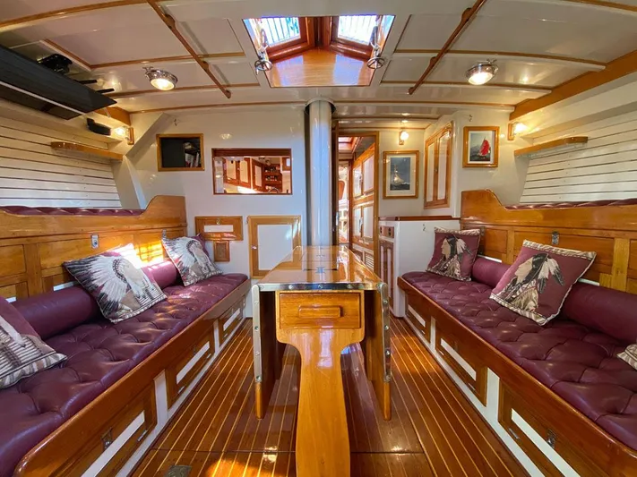 Windigo Yacht Photos Pics Interior of a 1956 Hinckley S & S Yawl, featuring polished wood and plush seating.