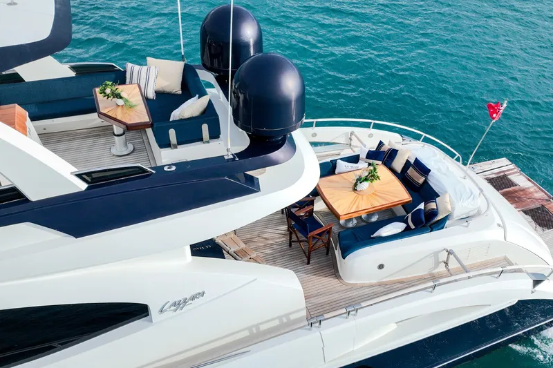 La Mar Yacht Photos Pics Luxurious 2012 Lazzara LSX 78 yacht with elegant outdoor seating on blue ocean.
