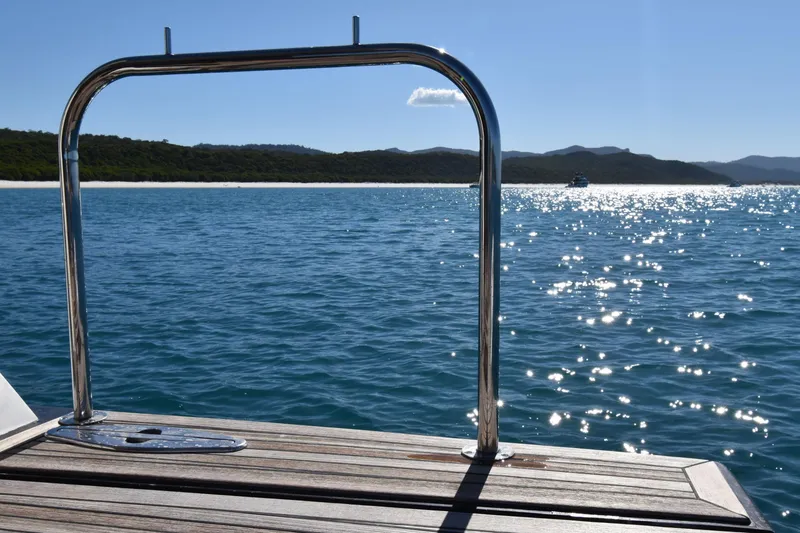 La Mar Yacht Photos Pics View from Lazzara LSX 78 yacht, 2012, overlooking sparkling ocean and distant shoreline.