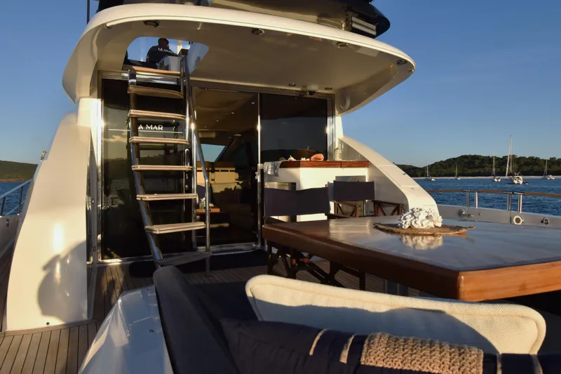 La Mar Yacht Photos Pics Luxurious 2012 Lazzara LSX 78 yacht deck with elegant seating and ocean view.