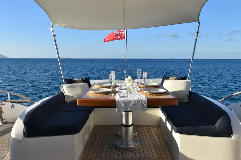 La Mar Yacht Photos Pics Luxurious dining setup on 2012 Lazzara LSX 78 yacht with ocean view.