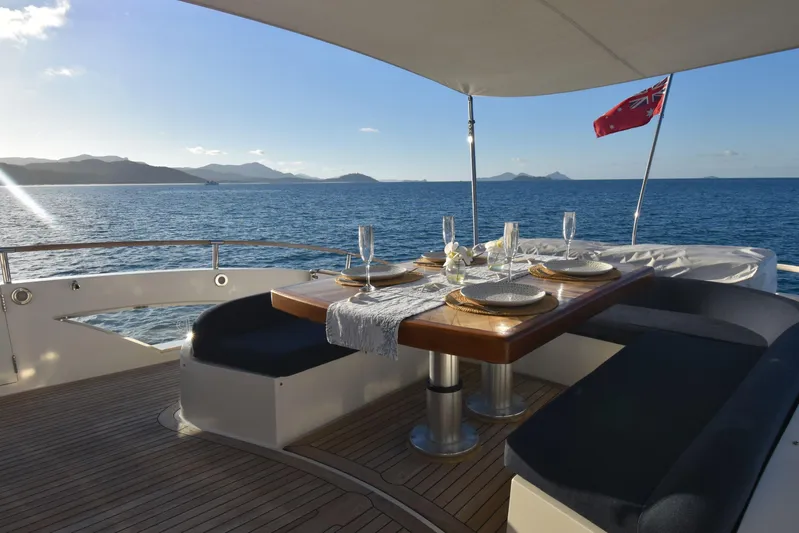 La Mar Yacht Photos Pics Luxurious dining area on 2012 Lazzara LSX 78 yacht with ocean view.