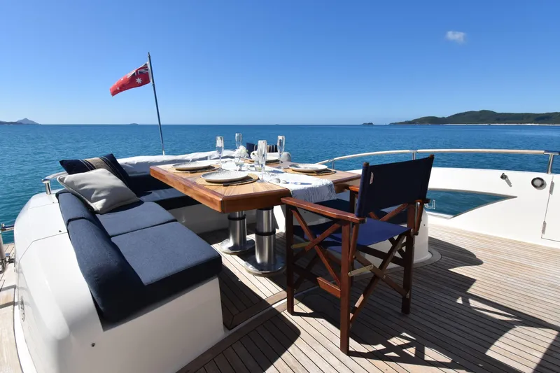 La Mar Yacht Photos Pics Luxury dining setup on 2012 Lazzara LSX 78 yacht deck, ocean view.