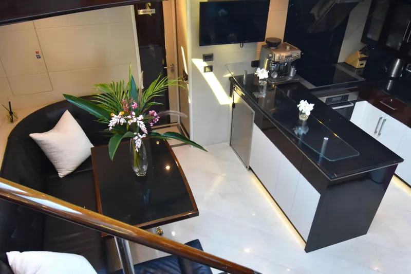 La Mar Yacht Photos Pics Luxurious interior of 2012 Lazzara LSX 78 yacht with modern kitchen and elegant decor.