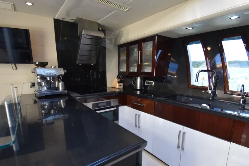 La Mar Yacht Photos Pics Luxurious kitchen interior of 2012 Lazzara LSX 78 yacht with modern appliances.