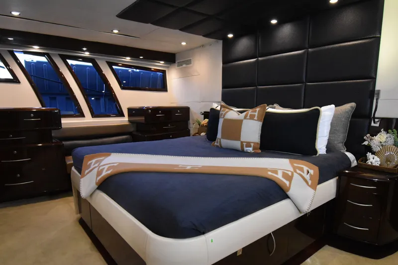 La Mar Yacht Photos Pics Luxurious bedroom interior of 2012 Lazzara LSX 78 yacht with elegant decor and modern design.