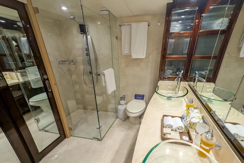 La Mar Yacht Photos Pics Luxurious bathroom in 2012 Lazzara LSX 78 yacht with glass shower and dual sinks.