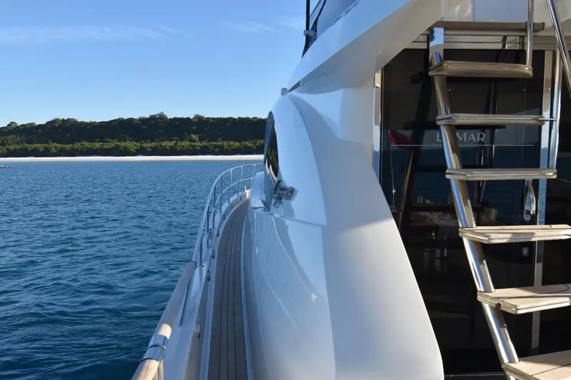 La Mar Yacht Photos Pics 2012 Lazzara LSX 78 yacht on serene blue water with sleek design and modern staircase.