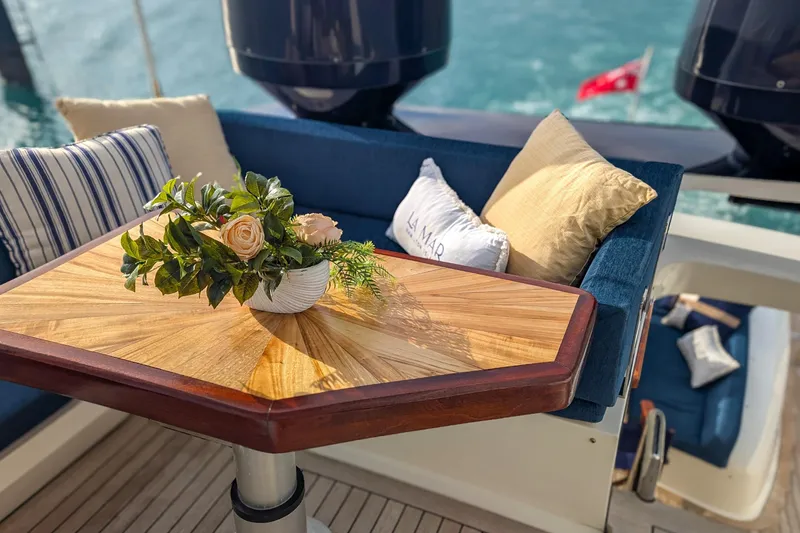 La Mar Yacht Photos Pics Luxurious 2012 Lazzara LSX 78 yacht deck with elegant seating and floral centerpiece.