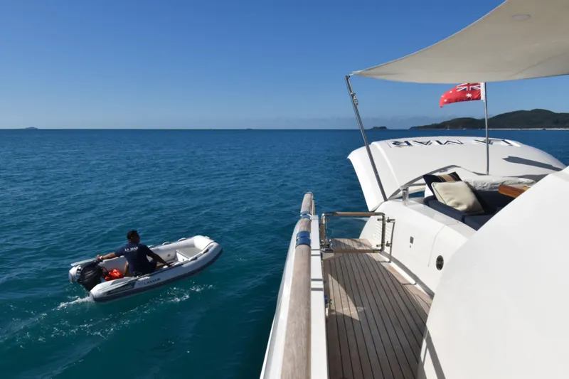 La Mar Yacht Photos Pics Luxury 2012 Lazzara LSX 78 yacht with tender in open sea.