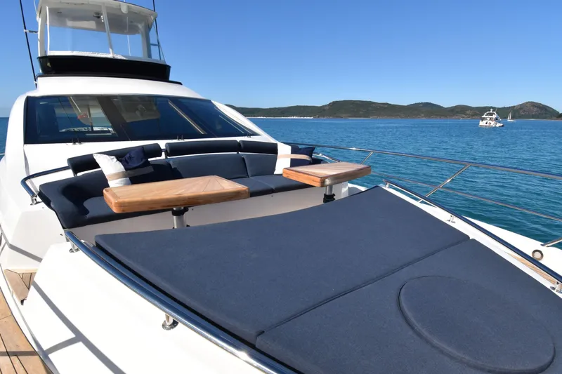 La Mar Yacht Photos Pics Luxury 2012 Lazzara LSX 78 yacht with sun deck, ocean view, and seating area.