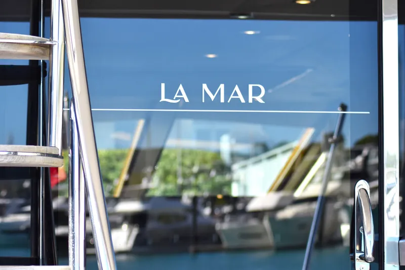 La Mar Yacht Photos Pics Glass door on 2012 Lazzara LSX 78 yacht with "La Mar" text.