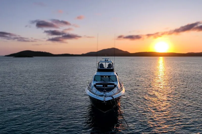 La Mar Yacht Photos Pics Lazzara LSX 78 yacht on serene water at sunset, 2012 model.