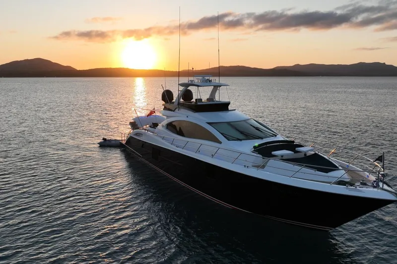La Mar Yacht Photos Pics Luxurious 2012 Lazzara LSX 78 yacht at sunset on tranquil waters.