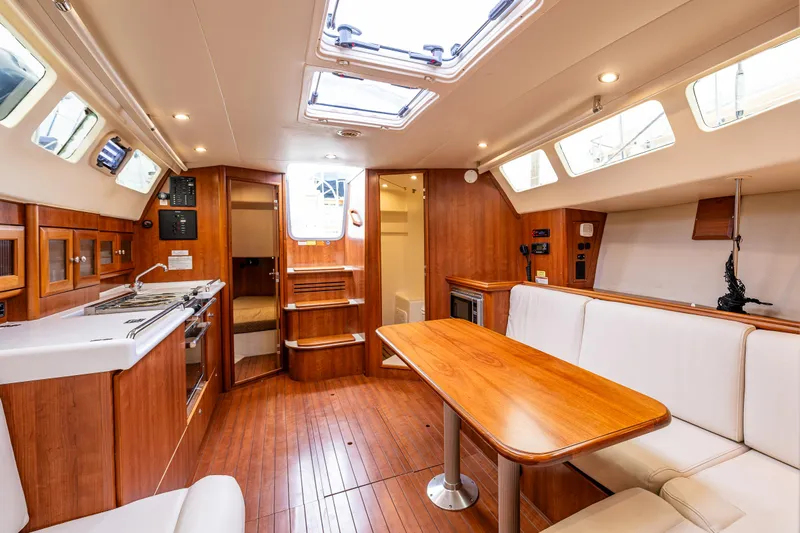  Yacht Photos Pics Interior of 2015 Marlow-Hunter 31 sailboat with wood finish and modern amenities.