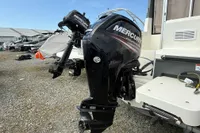 2019 Quicksilver 555 Pilothouse with Mercury outboard motor in a boatyard.