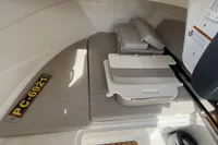 2019 Quicksilver 555 Pilothouse interior with seating and storage compartments.