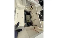 Open storage compartment on a 2019 Quicksilver 555 Pilothouse boat deck.