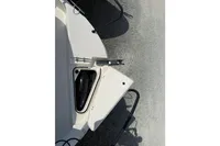 2019 Quicksilver 555 Pilothouse boat deck with open storage compartment.